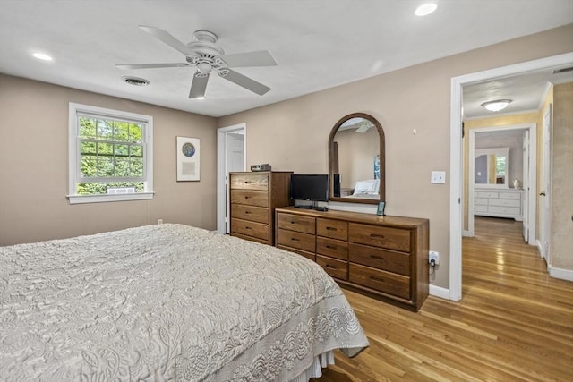 bedroom with light wood finished floors, baseboards, recessed lighting, and a ceiling fan