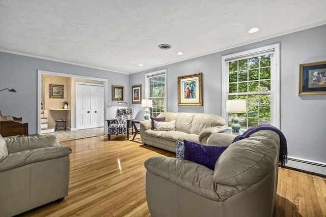 living room featuring crown molding, wood finished floors, baseboard heating, and recessed lighting