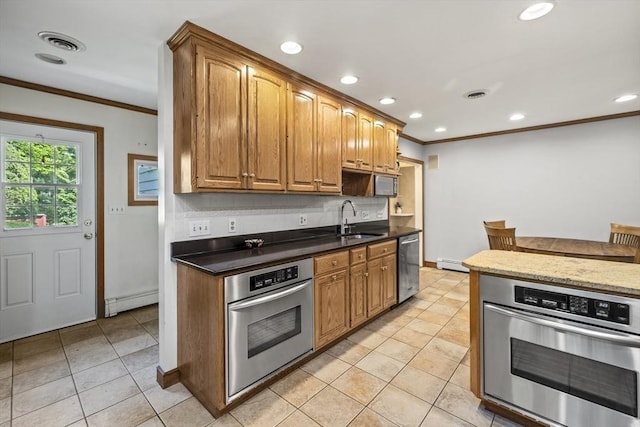 kitchen with stainless steel appliances, a sink, crown molding, light tile patterned floors, and recessed lighting