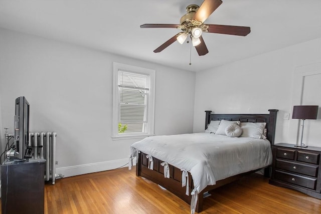 38 Torrey St, Boston, MA 02124 - bedroom featuring radiator, wood finished floors, baseboards, and a ceiling fan