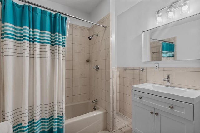 38 Torrey St, Boston, MA 02124 - bathroom featuring shower / bathtub combination with curtain, tile walls, vanity, and wainscoting