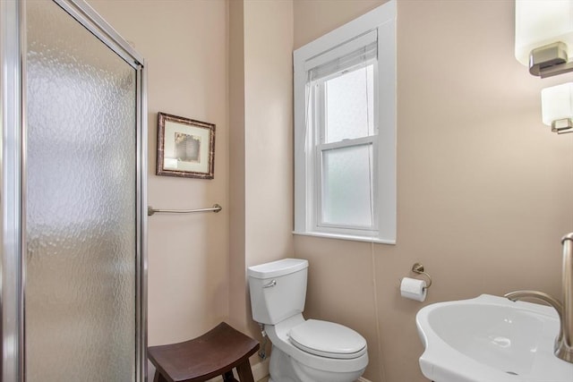 38 Torrey St, Boston, MA 02124 - bathroom with a shower stall, a sink, toilet, and baseboards