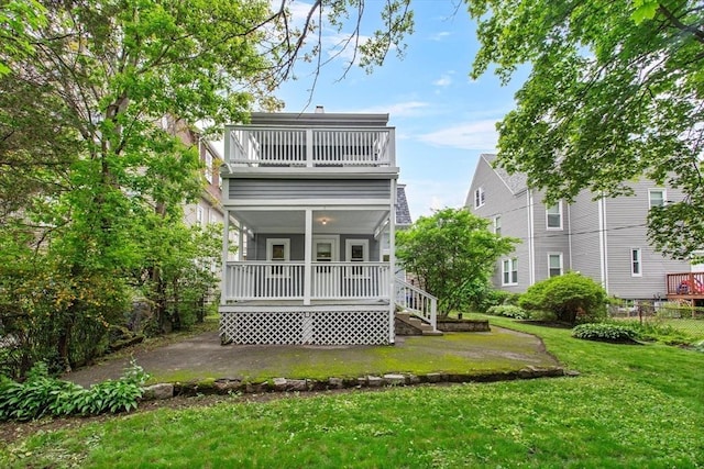 38 Torrey St, Boston, MA 02124 - back of house with a yard, a porch, and a balcony