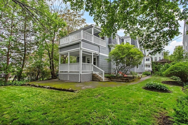 38 Torrey St, Boston, MA 02124 - rear view of property featuring a balcony and a yard