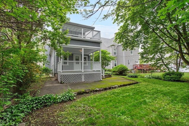 38 Torrey St, Boston, MA 02124 - back of house with a balcony, a lawn, and a porch
