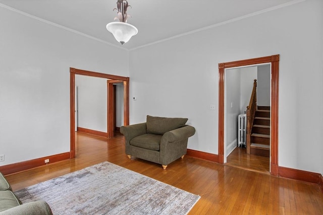 38 Torrey St, Boston, MA 02124 - sitting room with baseboards, hardwood / wood-style flooring, radiator heating unit, crown molding, and stairs