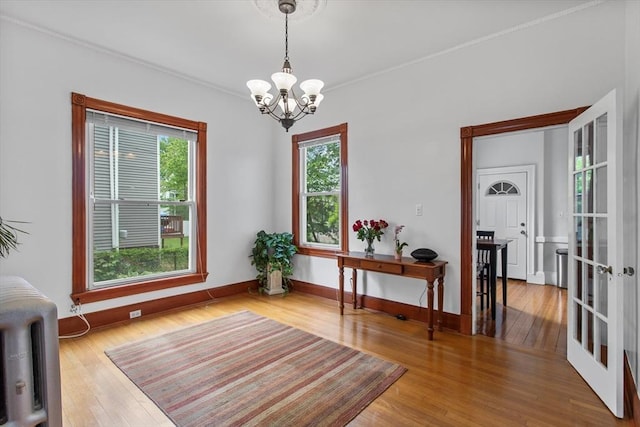 38 Torrey St, Boston, MA 02124 - interior space with a chandelier, wood finished floors, baseboards, and crown molding