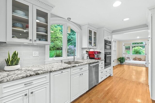4 Worthen Rd, Winchester, MA 01890 - kitchen featuring dishwasher, a sink, white cabinets, light wood-style floors, and recessed lighting