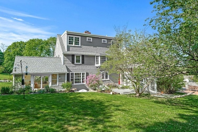 4 Worthen Rd, Winchester, MA 01890 - rear view of house with a yard and a chimney
