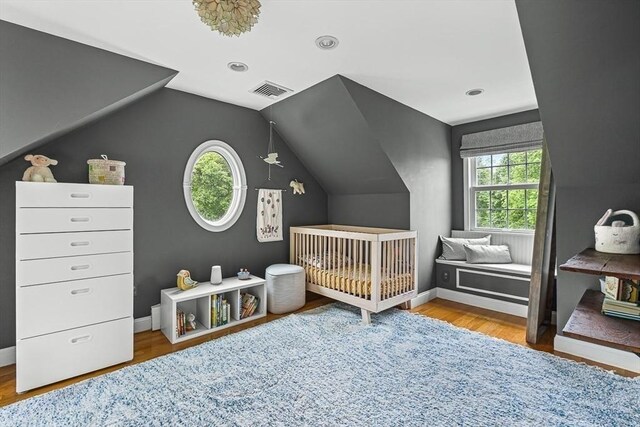 4 Worthen Rd, Winchester, MA 01890 - bedroom featuring lofted ceiling, a nursery area, wood finished floors, and baseboards