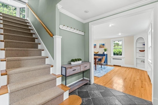 4 Worthen Rd, Winchester, MA 01890 - stairway with ornamental molding, radiator, built in features, recessed lighting, and baseboards