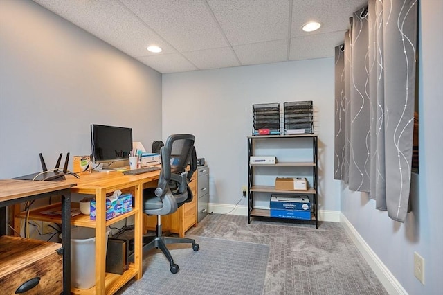 home office with carpet flooring, baseboards, recessed lighting, and a paneled ceiling