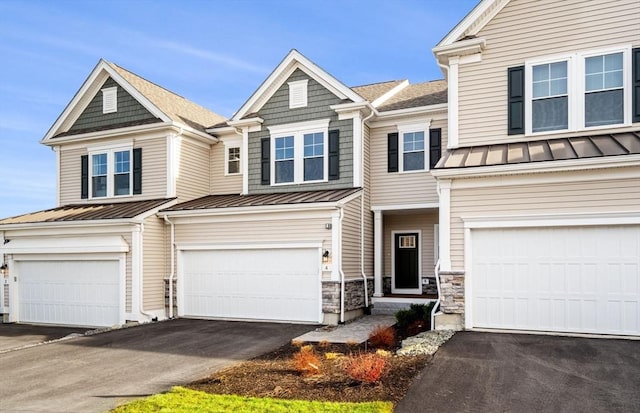 15 Mason Way Unit 73, Woburn, MA 01801 - multi unit property with a standing seam roof, a garage, driveway, a metal roof, and a shingled roof