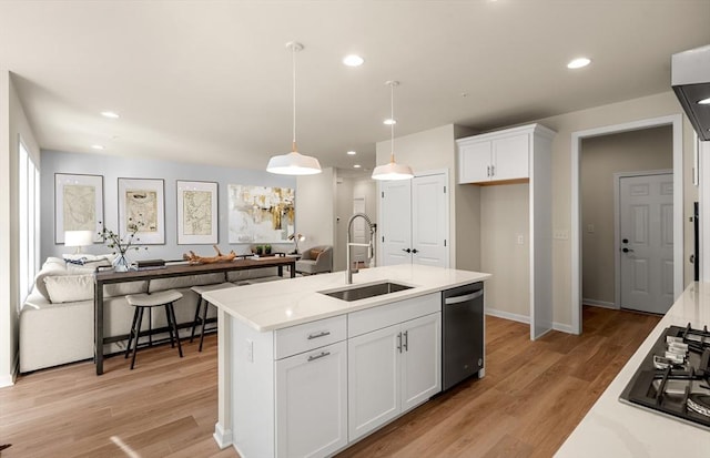15 Mason Way Unit 73, Woburn, MA 01801 - kitchen with stainless steel appliances, white cabinets, decorative light fixtures, light wood-style flooring, and recessed lighting