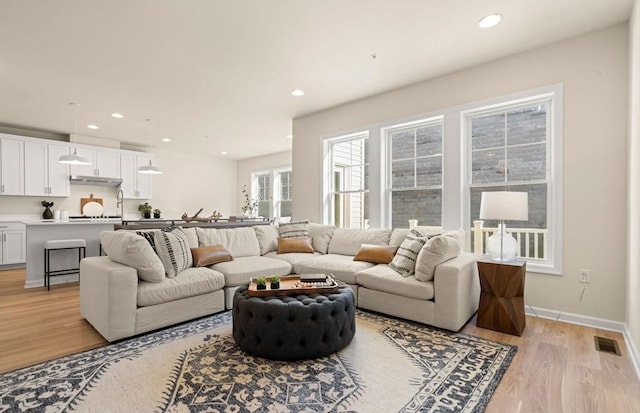 15 Mason Way Unit 73, Woburn, MA 01801 - living room with light wood finished floors and recessed lighting
