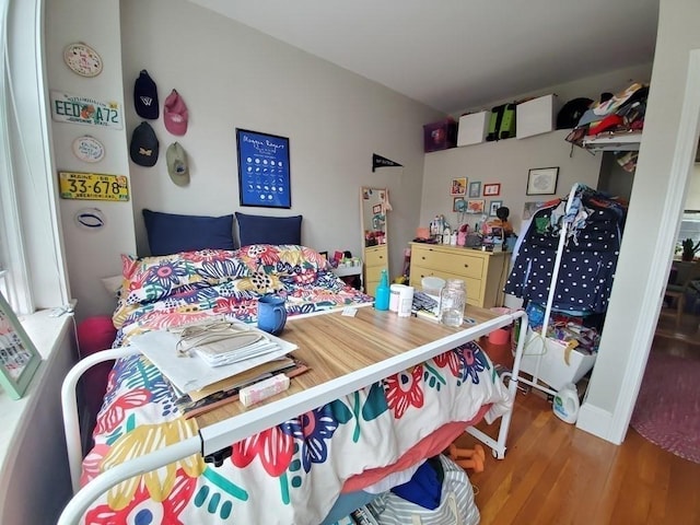 bedroom with wood finished floors