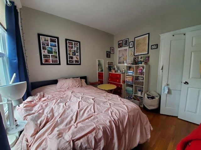 bedroom with wood finished floors