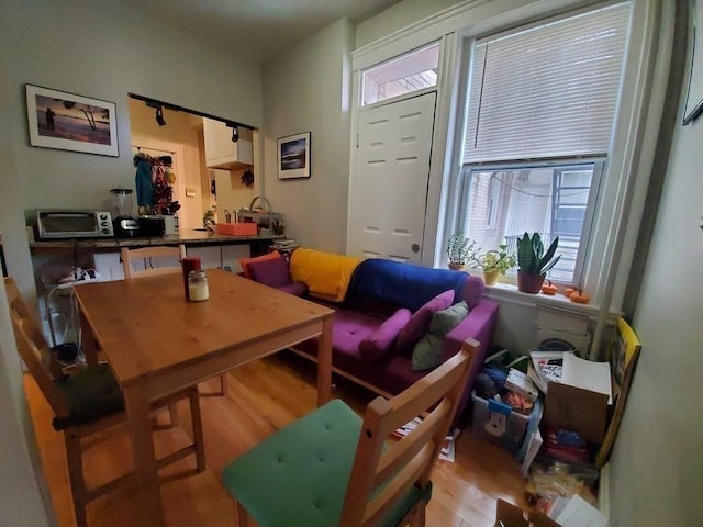 dining space with light wood-type flooring