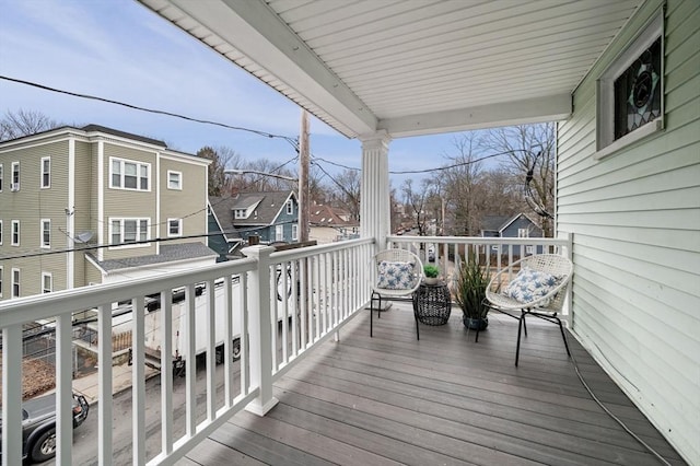 wooden terrace with a residential view