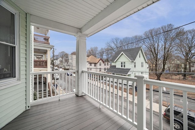 wooden deck with a residential view