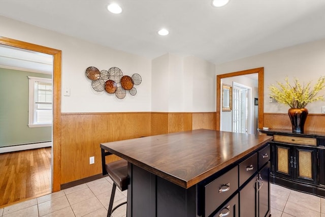 7 Coolidge Rd, Danvers, MA 01923 - kitchen featuring a wainscoted wall, wooden walls, baseboard heating, dark cabinets, and recessed lighting