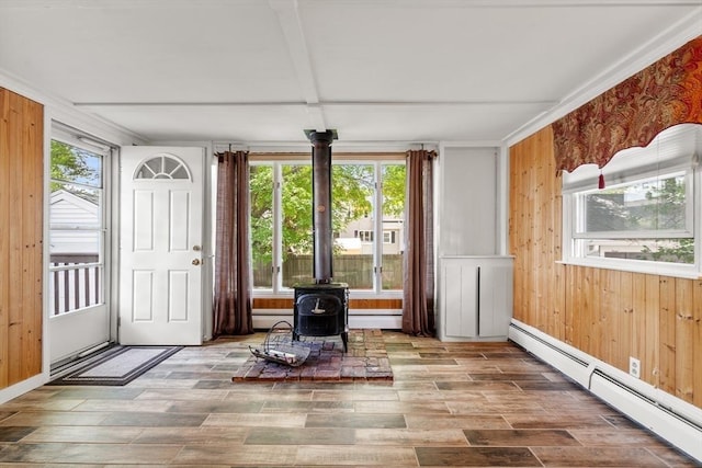 7 Coolidge Rd, Danvers, MA 01923 - sunroom with a baseboard radiator, a wood stove, and french doors