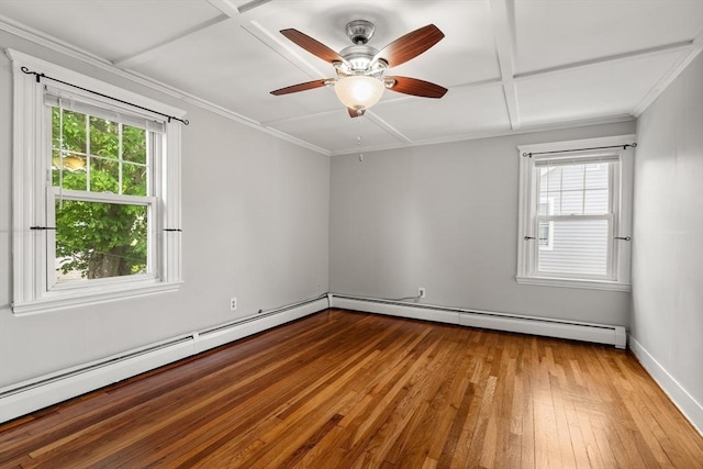 7 Coolidge Rd, Danvers, MA 01923 - empty room featuring plenty of natural light, wood-type flooring, baseboard heating, ceiling fan, and crown molding