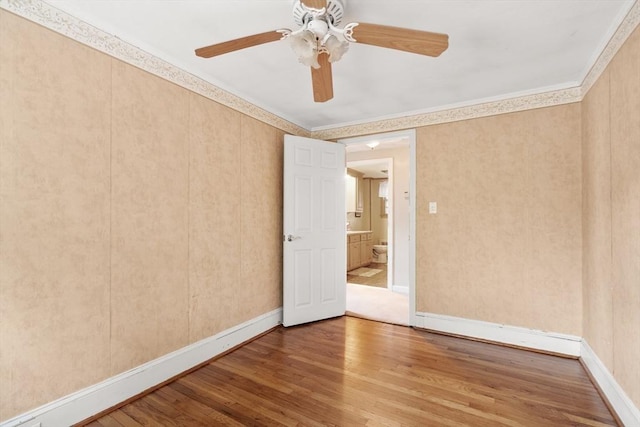 7 Coolidge Rd, Danvers, MA 01923 - unfurnished room with wood finished floors, ornamental molding, ceiling fan, and baseboards