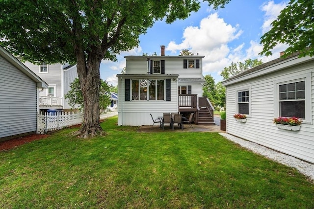 7 Coolidge Rd, Danvers, MA 01923 - back of property with a wooden deck, a patio area, and a chimney