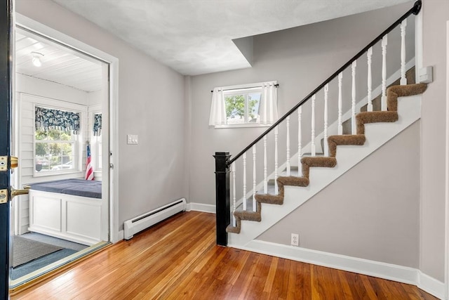 7 Coolidge Rd, Danvers, MA 01923 - foyer featuring baseboard heating, baseboards, hardwood / wood-style floors, and stairway