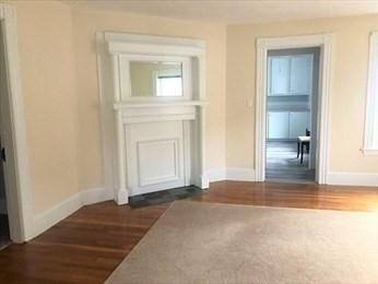 40 June St, Worcester, MA 01602 - hallway with dark wood-style flooring and baseboards