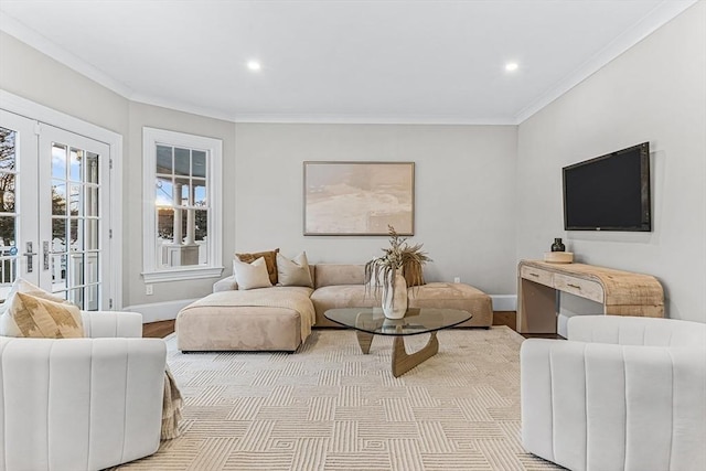 living area with baseboards, light wood-style flooring, crown molding, french doors, and recessed lighting