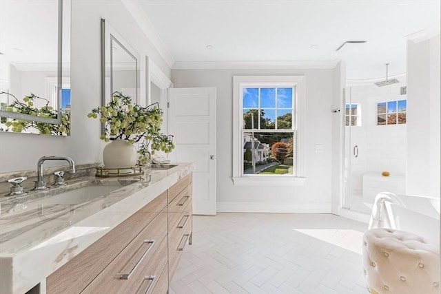 bathroom featuring a shower stall, baseboards, crown molding, and vanity