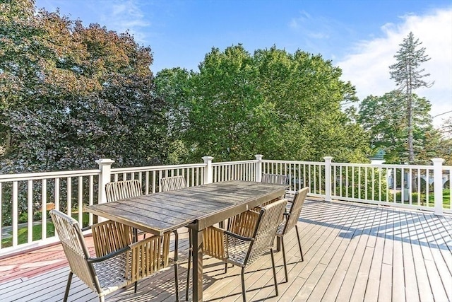 wooden deck with outdoor dining space