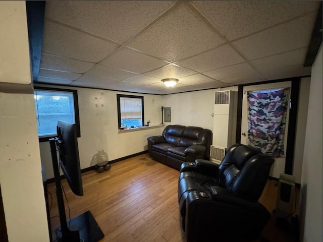 18 Laurel Ave, Sterling, MA 01564 - living area featuring wood finished floors, a paneled ceiling, baseboards, and electric panel