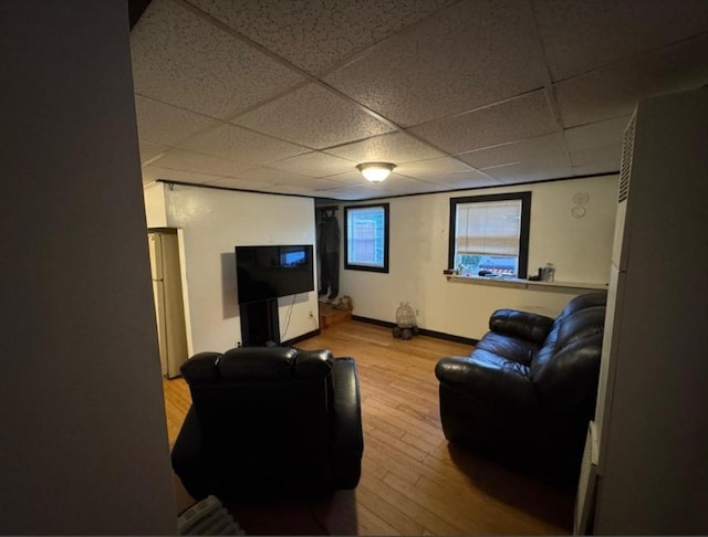 18 Laurel Ave, Sterling, MA 01564 - living area featuring a paneled ceiling, wood finished floors, and baseboards