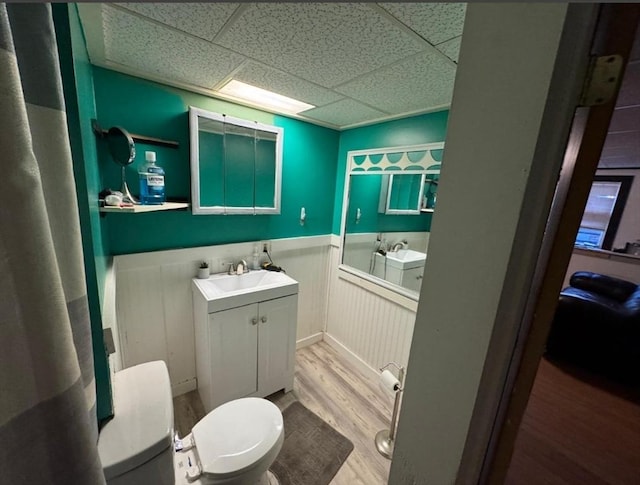 18 Laurel Ave, Sterling, MA 01564 - full bathroom with a wainscoted wall, toilet, a bath, wood finished floors, and vanity