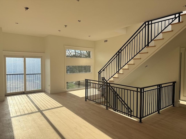 staircase with wood-type flooring