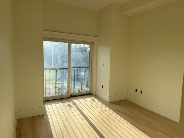 spare room with light hardwood / wood-style flooring