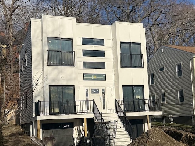 back of house with a garage