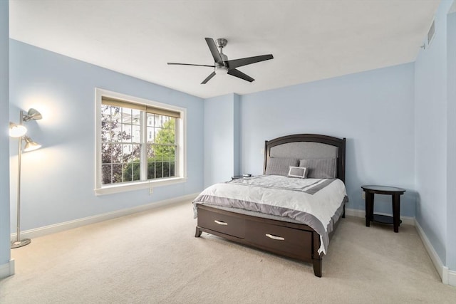 bedroom with ceiling fan and light carpet