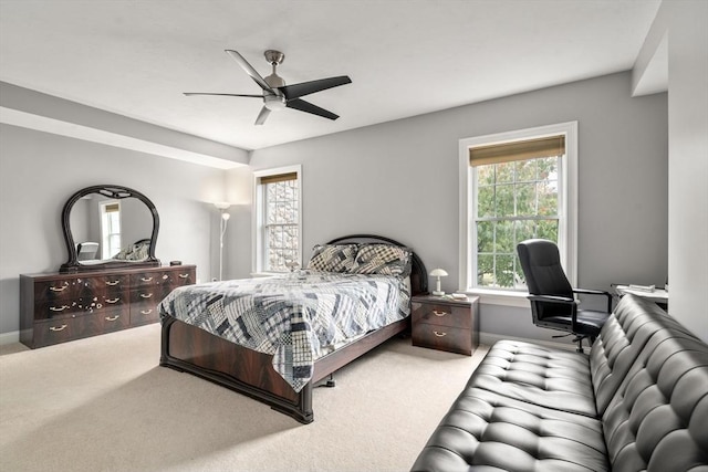 carpeted bedroom with ceiling fan