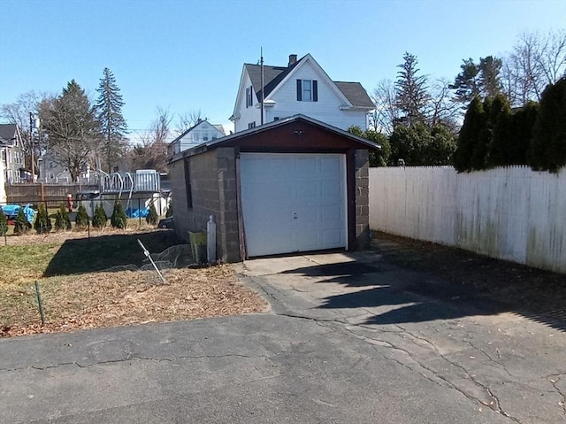 13 William St, Westfield, MA 01085 - detached garage featuring asphalt driveway and fence