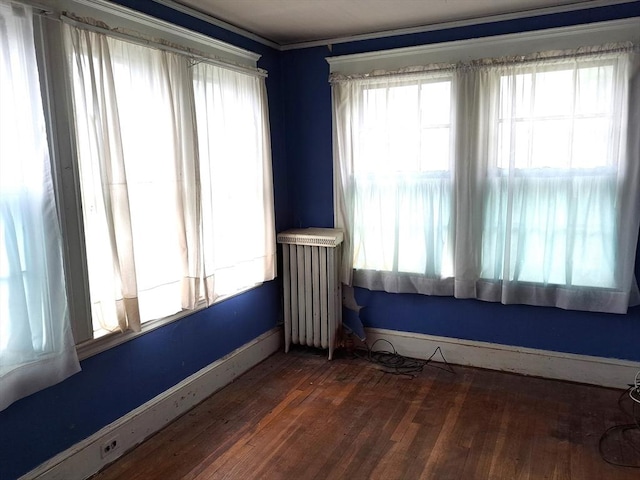 281 Elmwood Ave, Quincy, MA 02170 - unfurnished room with radiator and wood finished floors