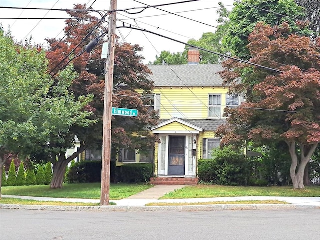 281 Elmwood Ave, Quincy, MA 02170 - view of front facade featuring a chimney and roof with shingles