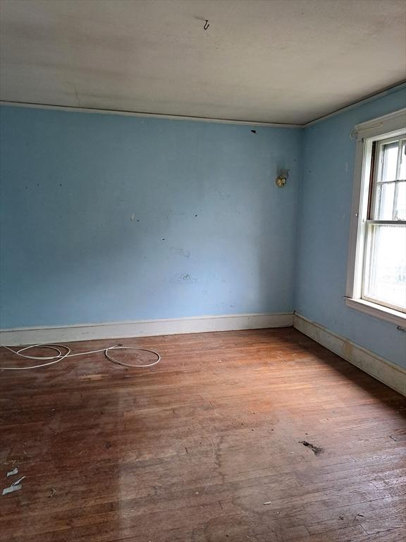 281 Elmwood Ave, Quincy, MA 02170 - spare room featuring wood finished floors and baseboards