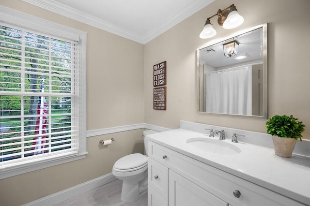 bathroom with baseboards, vanity, toilet, crown molding, and a shower with curtain