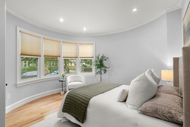 42 Coolidge St Unit 42, Brookline, MA 02446 - bedroom with ornamental molding, multiple windows, light wood finished floors, recessed lighting, and baseboards