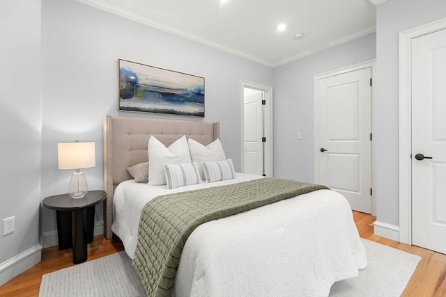 42 Coolidge St Unit 42, Brookline, MA 02446 - bedroom with ornamental molding, light wood-style floors, and baseboards