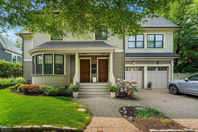 42 Coolidge St Unit 42, Brookline, MA 02446 - shingle-style home with an attached garage, a porch, decorative driveway, a shingled roof, and a front lawn